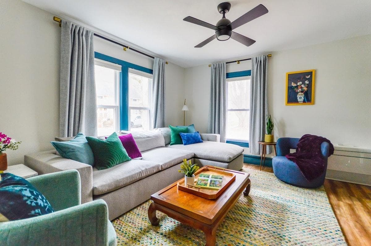 Relax in the cozy living room designed for comfort and connection. Plush seating invites you to unwind while enjoying your favorite shows or movies on a 50-inch smart Roku TV.